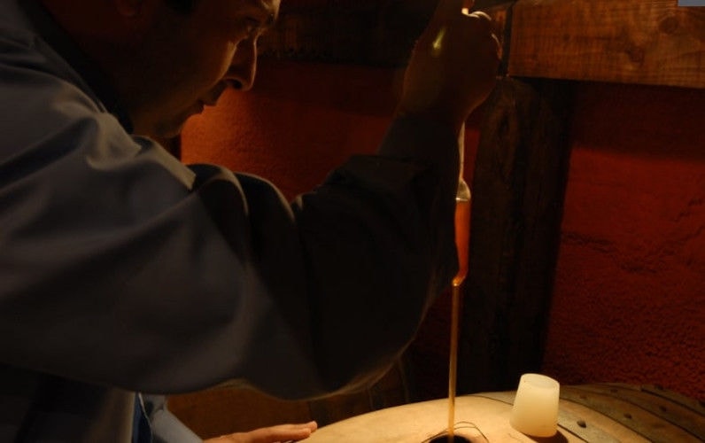 oenologist making wine analyses in 'Koutsoyannopoulos winery' cellar